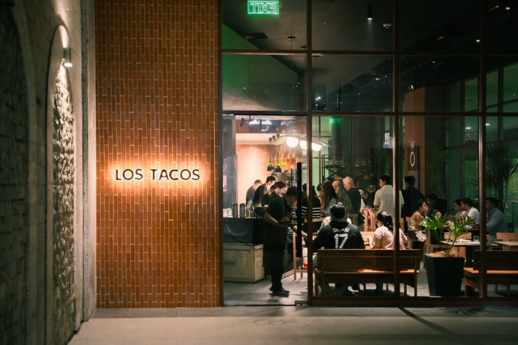 Los Tacos MNL restaurant exterior in BGC at night