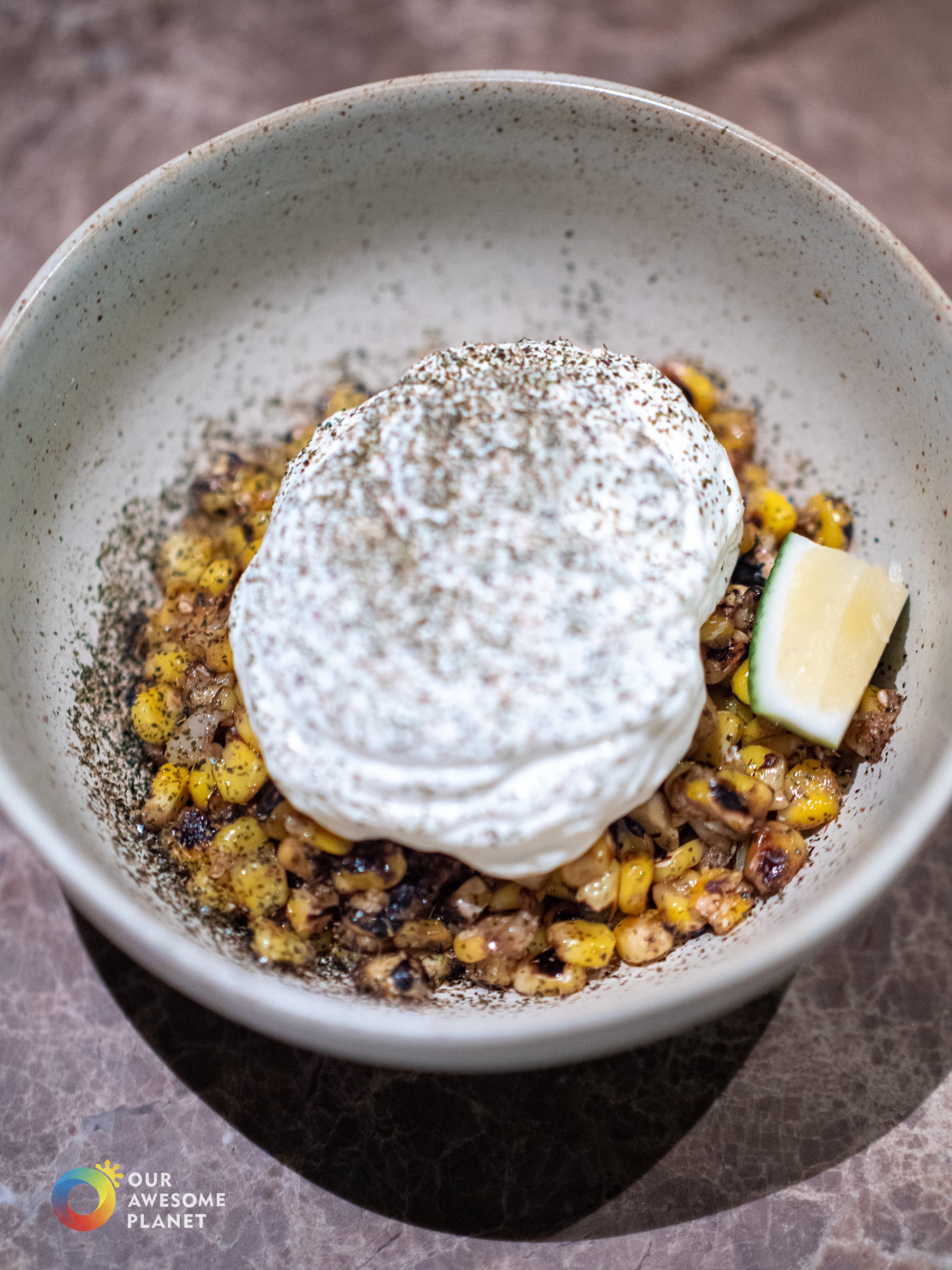 Esquites - grilled corn with habanero crema and furikake in bowl