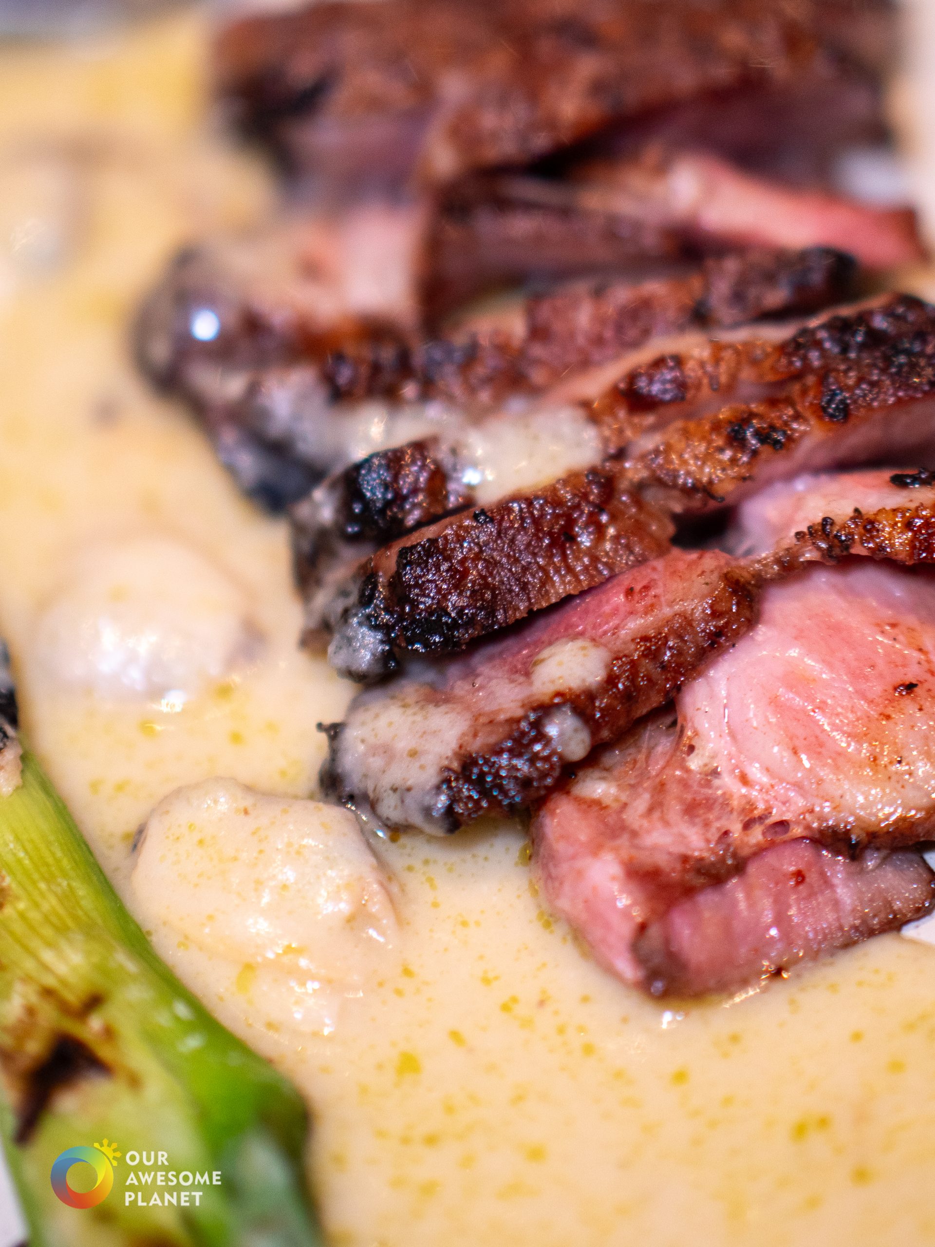 Iberico pork with creamy bean sauce and grilled leeks