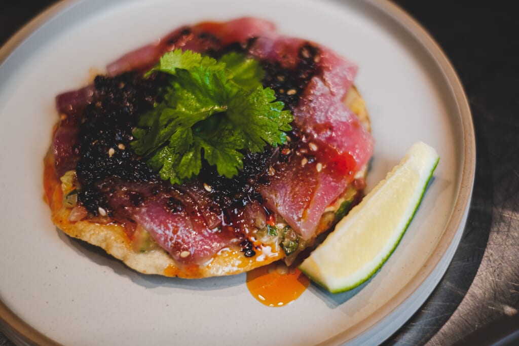 Tuna tostada with salsa fresca and chipotle crema